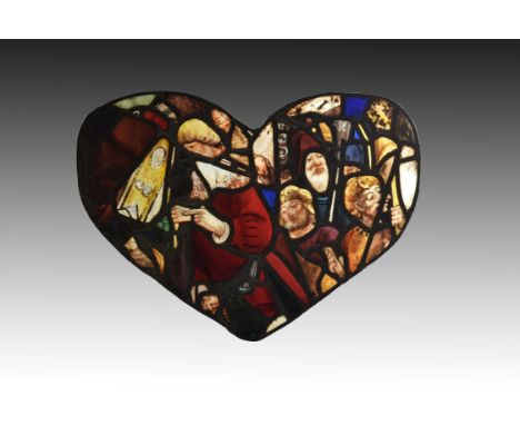 An unusual composite stained glass panel with portrait heads, probably French, incorporating possibly 16th century elements, 