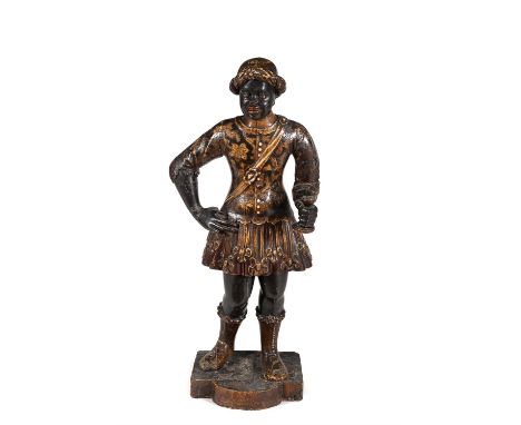 A Venetian carved wood, polychrome painted and parcel gilt figure of a Blackamoor, 18th century, depicted wearing a turban an