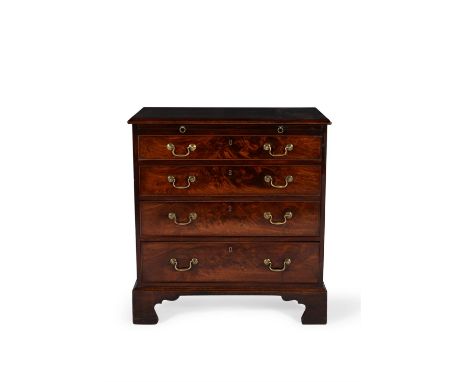 A George III mahogany bachelor's chest of drawers, circa 1780, the rectangular top with moulded edge, above a brushing slide 