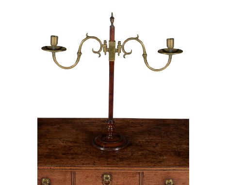 A George III mahogany and brass mounted height adjustable twin light candelabrum, circa 1780, the rectangular stem surmounted