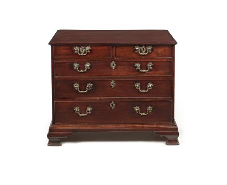A George III mahogany chest of drawers, circa 1770, the rectangular top with moulded edge, above two short and three long gra