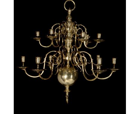 A companion pair of Dutch brass twelve light chandeliers, in 18th century style, each with two tiers of sconces arranged arou