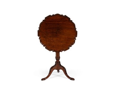 A George III mahogany tripod table, circa 1760, the hinged 'pie crust' top, above a turned tapering baluster stem incorporati