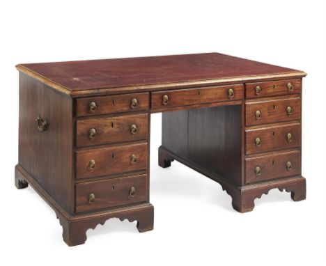 A George III mahogany partners pedestal desk, circa 1780, the rectangular top with tooled leather inset writing surface and m
