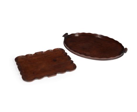 A George III mahogany oval tray, circa 1770, in the manner of Thomas Chippendale, with serpentine raised edge and gadrooned s