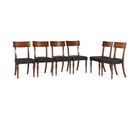 A set of twelve Regency mahogany dining chairs, circa 1820, in the manner of Thomas Hope, possibly by Gillows, each curved ta