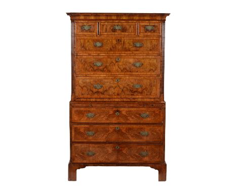 A George II walnut and crossbanded chest on chest, circa 1740, the cavetto shaped cornice above three short and three long gr