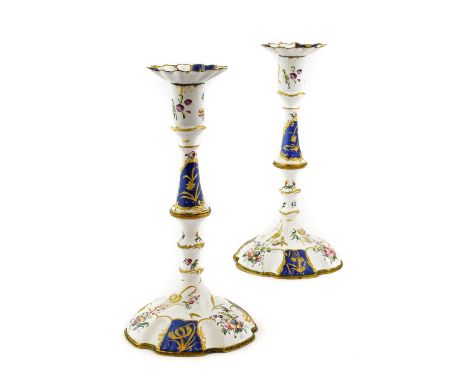 A Pair of South Staffordshire Enamel Candlesticks, circa 1770, with detachable drip pans, cylindrical sockets, knopped stems 