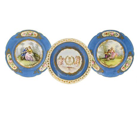 A Pair of Sevrès Style Porcelain Plates, circa 1900, painted with 18th century lovers in landscape on a blue ground with pane