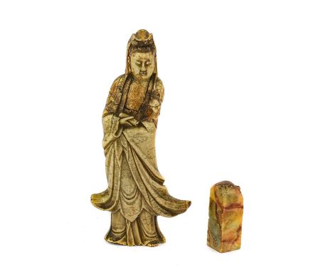 A Chinese Soapstone Figure of Guanyin, Qing Dynasty, possibly 18th century, of traditional form, standing in flowing robes26c