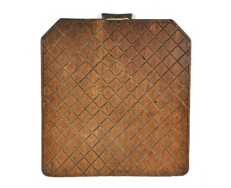 A Fruitwood Oakcake Riddle Board, 19th century, of canted rectangular form with incised diamond diaper, the handled initialle