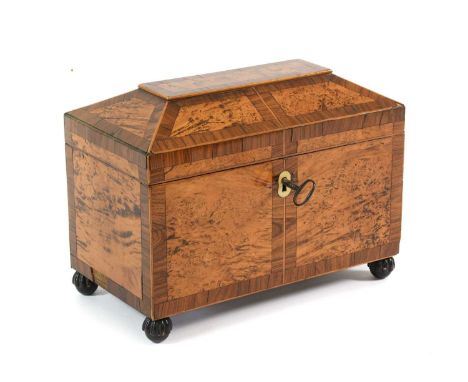 A Regency Burr Walnut and Rosewood-Crossbanded Tea Caddy, of sarcophagus form, containing three zinc canisters, on gadrooned 