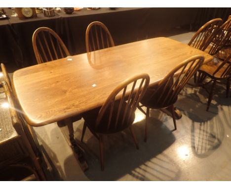 Ercol refectory dining table with four matching stick back chairs, L: 180 cm