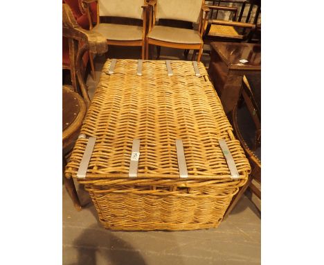 Large theatrical trunk with metal binding and leather straps