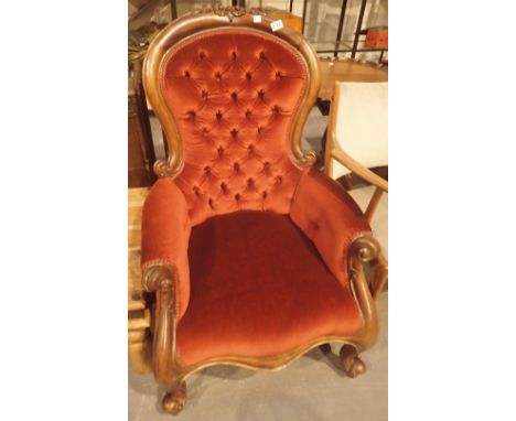 Mahogany Queen Anne style armchair with red plush upholstery and button back