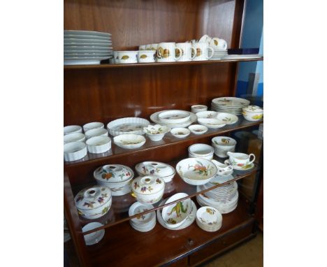 A Large Quantity of Royal Worcester Evesham Ware, comprising six coffee cups and saucers, milk jug, two oval lidded serving d