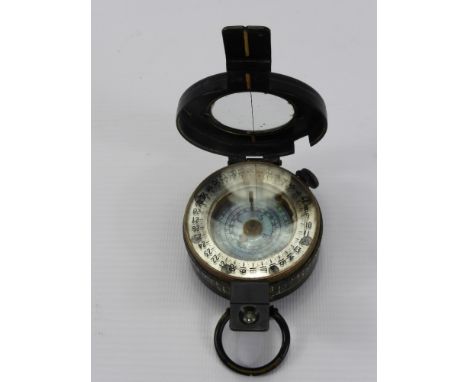 A WWI Compass, marked T.G. Co. Ltd., London, NEB 34128, 1940 MK III, liquid intact.