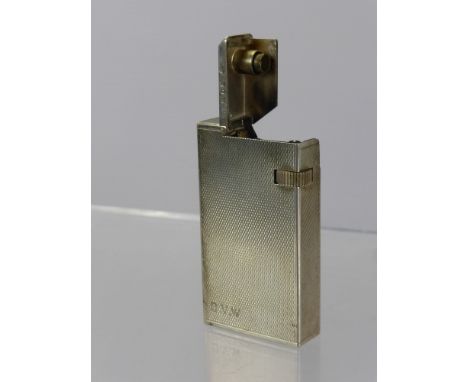 A Solid Silver Vintage Dunhill Lighter, the engine turned lighter initialled D.W.V., London hallmark dd 1936, approx 74 gms.