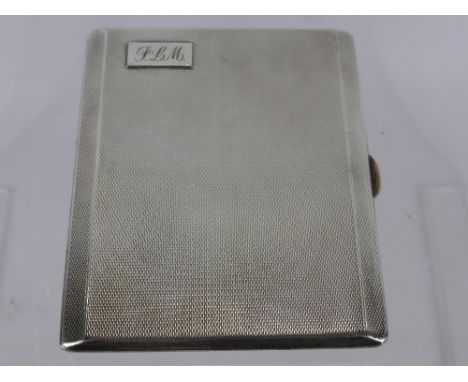 A Solid Silver Engine Turned Cigarette Case, the case having gilded interior and engraved "Presented to Sgt. F.L. Maisey by t