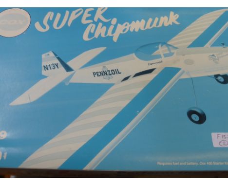 A Boxed Unassembled Kit Super Chipmunk 0.49 Engine Powered Stunt Flyer,  together with instructions.