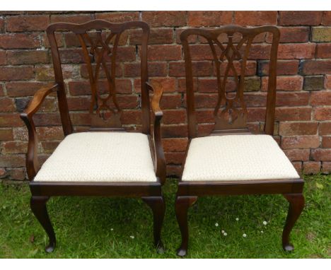 A Set of Chippendale Style Mahogany/Walnut Dining Chairs, including two carvers.