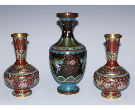 A pair of Chinese cloisonne enamel ovoid vases, decorated in polychrome with butterflies, lotus and scrolling foliage on a ve