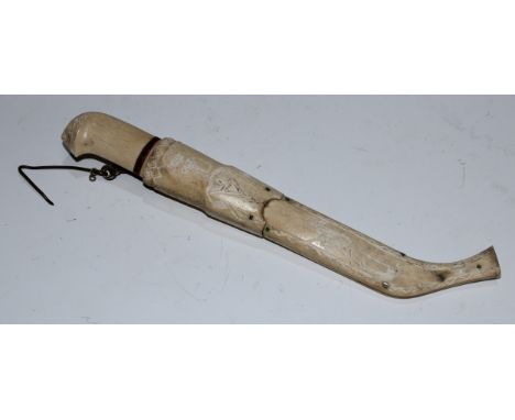 A Lapp or Sami leuku dagger, the 9cm blade with inscription, bone grip and scabbard sgraffito engraved, 24cm long overall 