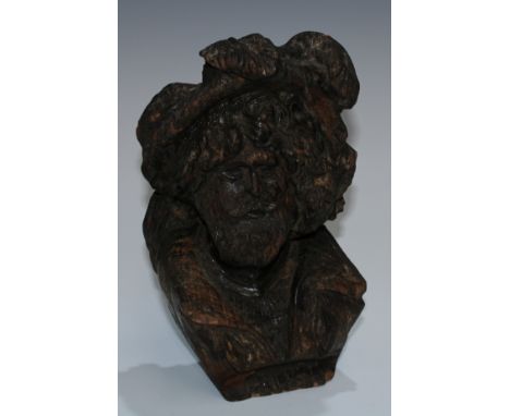 A North European oak carved sculptural architectural fragment, depicting Faust, bust-length, 23.5cm high, 19th century 