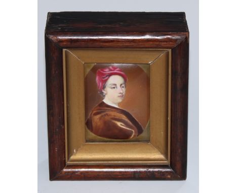A George III enamel portrait panel, of a gentleman wearing a turban, within a feigned oval, 8.5cm x 6cm, c.1780, mahogany fra