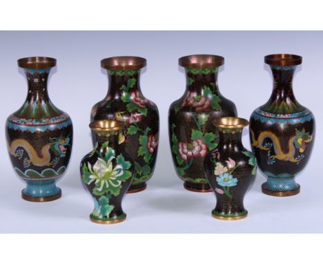 A pair of Chinese cloisonne enamel ovoid vases, decorated in the famille noir palette with flowers and scrolls, 22cm high; an