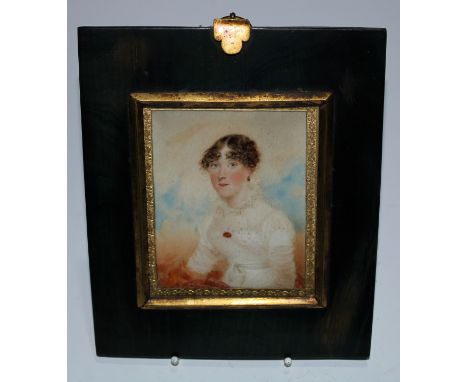 English School (early 19th century), a portrait miniature, of a young lady, half-length wearing a cream dress, her hair in ri