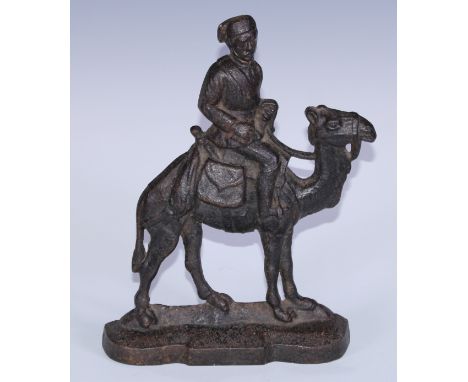 A Victorian cast iron portrait door stop, as Major-General Charles George Gordon (1833 - 1885), depicted  mounted on a camel,