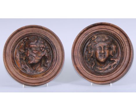 A pair of 19th century composition sculptural portrait roundels, in the Renaissance taste, oak frames, 18cm diam overall 