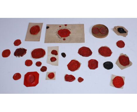 A collection of twenty-eight 18th and early 19th century red wax glyptic intaglio impressions, depicting aristocratic armoria