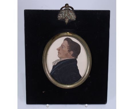 English School (early 19th century), a cut-out portrait miniature, of a gentleman, half-length wearing a blue jacket and fanc