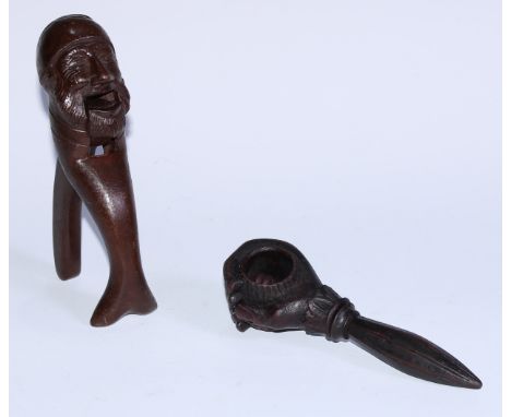 Nutcrackers - a Black Forest type oak screw-action novelty nut cracker, carved as a fist clenching a nut, 18cm long, early 20