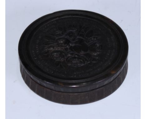 A 19th century pressed horn circular snuff box, by Wilson of Sheffield, the push-fitting cover in relief with with Cupid and 