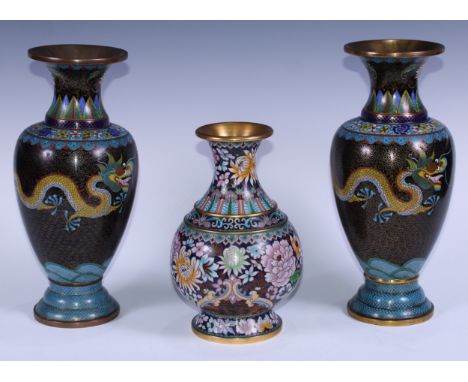 A pair of Chinese cloisonne enamel ovoid vases, decorated in the famille noir palette with dragons chasing the flaming pearl,