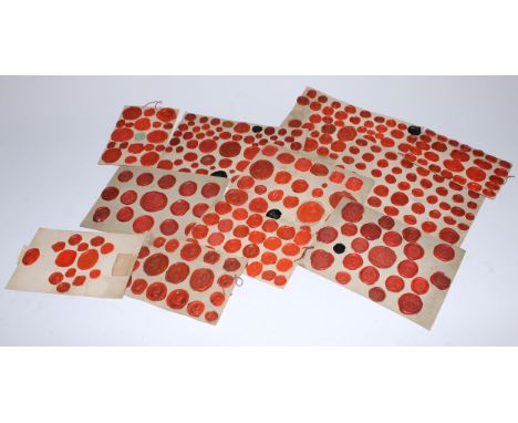 A large collection of 18th and early 19th century red wax impressions, taken from seal matrices and intaglios, the majority G