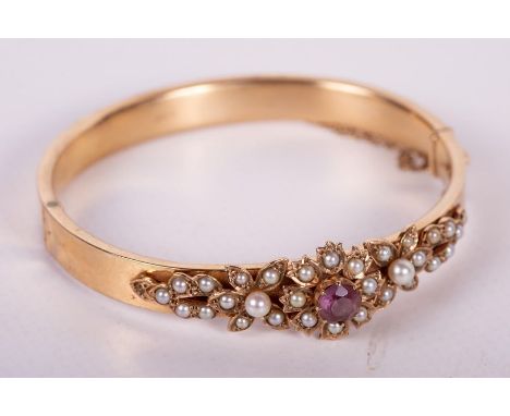 A 1960s Victorian Revival style floral seed pearl and paste 9ct gold bangle. Hallmarked Birmingham, 1968. Gross weight approx