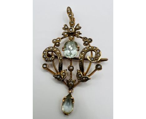 A seed pearl and aquamarine lavaliere pendant, with brooch clasp in yellow metal, stamped 9ct. Measures approximately 52 mm b