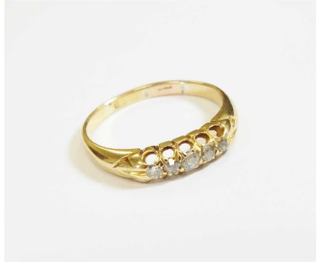 An 18ct gold graduated five stone diamond ring, the five old cut diamonds claw set to yellow metal band, ring size approx P, 