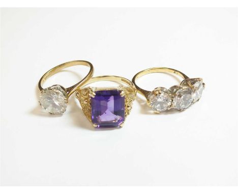 A 9ct gold amethyst single stone dress ring, with decorative floral shoulders, size O, together with a 9ct gold cubic zirconi