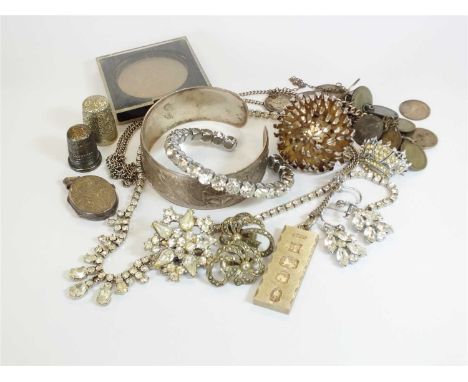 A small collection of costume jewellery; comprising; a silver bangle hallmarked Birmingham 1961, a faceted paste set bangle, 