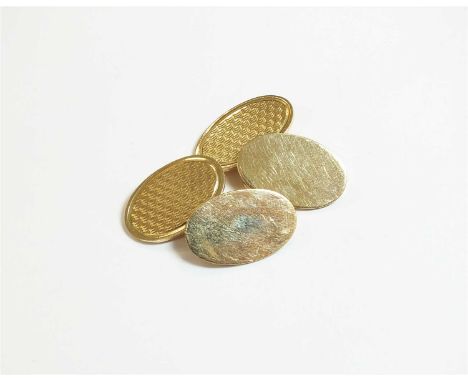 A pair of 9ct gold cufflinks, each designed as a plain polished and an engine turned oval plaque linked with chain, hallmarke