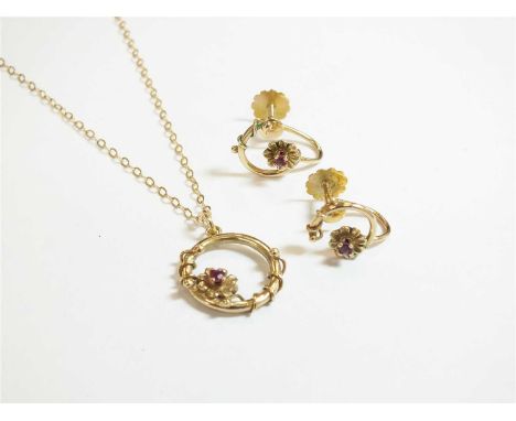 A 9ct gold ruby pendant, designed as a single faceted ruby set 'flower' mounted to circular pendant loop, suspended from yell