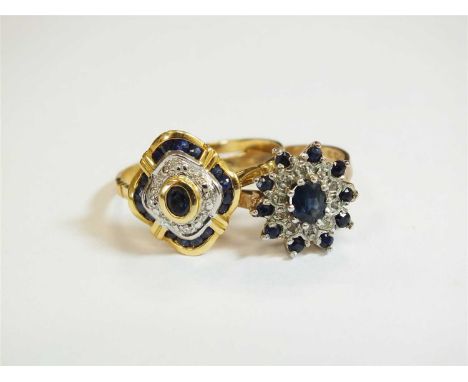 A French gold sapphire and diamond cluster ring, designed as a central oval mixed cut sapphire collet set in yellow metal and