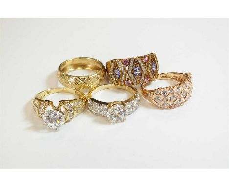 A 14ct gold decorative band, size N 1/2, together with three 14ct gold cubic zirconia rings, one size N, two size O and a 9ct