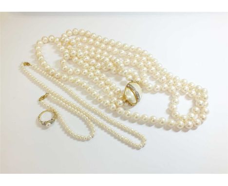 A two strand uniform cultured pearl necklace, with paste set simulated pearl clasp, stamped '800', length approx 83cm, pearls