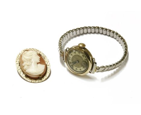 A ladies 9ct gold mechanical watch head, marked to inside case Dennison, with later expanding bracelet, a 9ct gold shell came